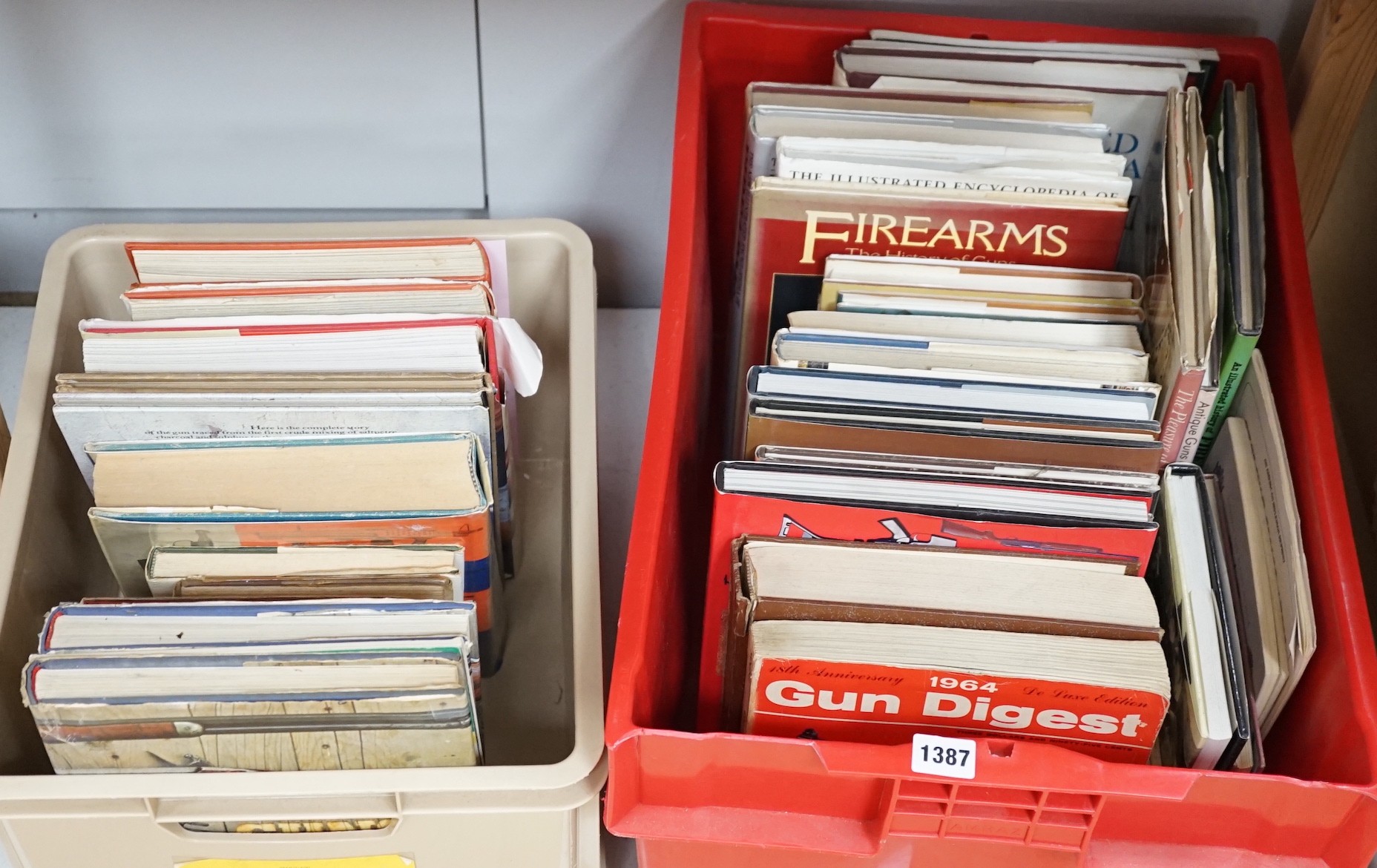 A quantity of reference books on weapons